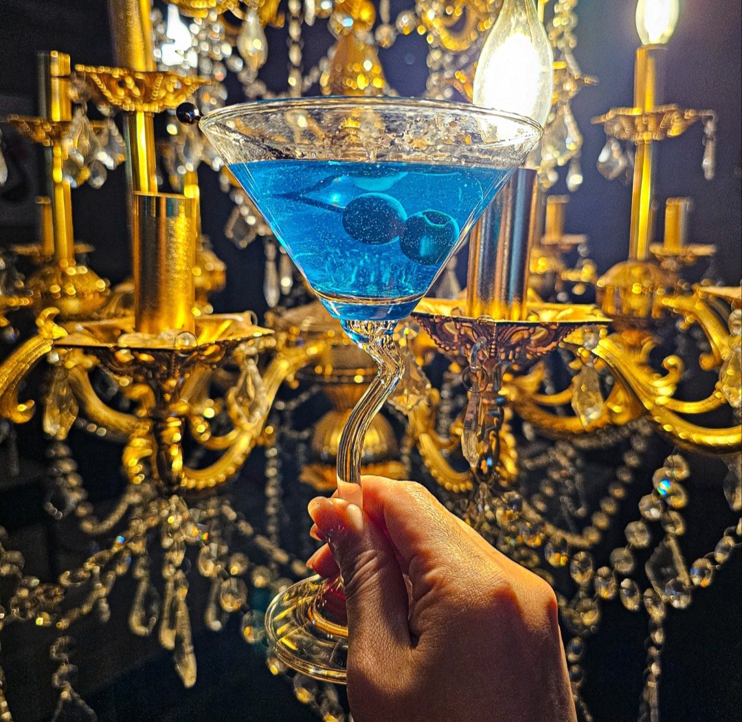 Cocktail bottles and bar drinks at UNLIMITED